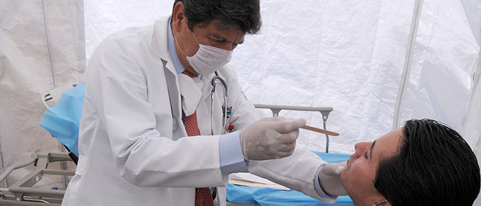 Mexican doctor examining patient