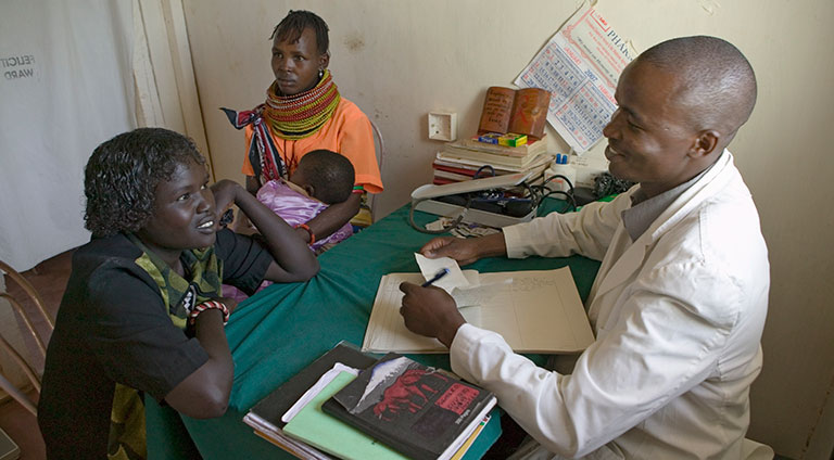 A doctor consulting with patients. 