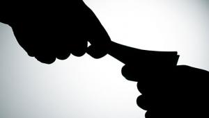 A bribe changing hands 