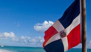 Dominican Republic flag on the beach 