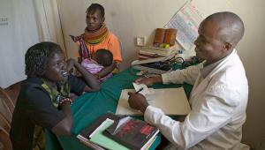 A doctor consulting with patients. 