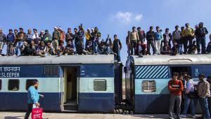 Crowded train waiting to depart.