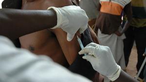 A man being vaccinated for yellow fever. 