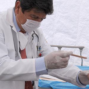 A Mexican doctor a examining patient