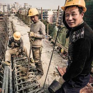 Migrant employees at work on a construction site