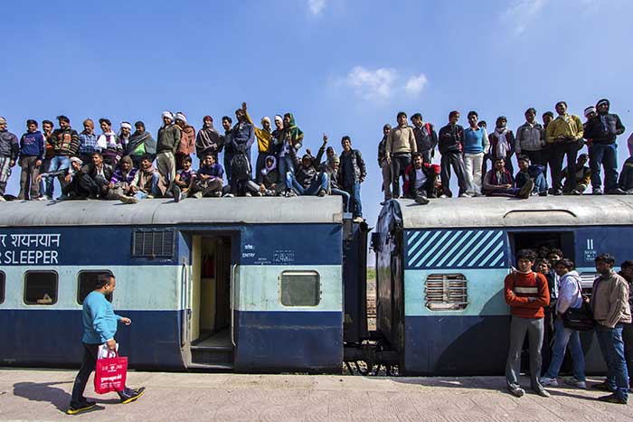 Crowded train waiting to depart.