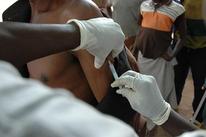 A man being vaccinated for yellow fever. 